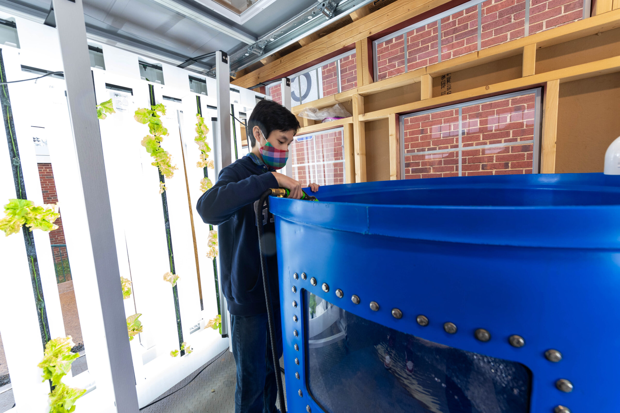 Middle School Students Use Vertical Farming System to Feed Families